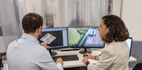 Worldwide Operations, Two people working in front of computer screens